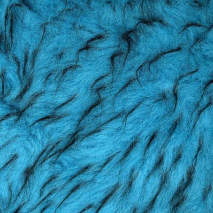 Muestra de tela peluche color azul jaspeado, textura de pelo.